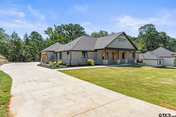 a house with swimming pool in front of it