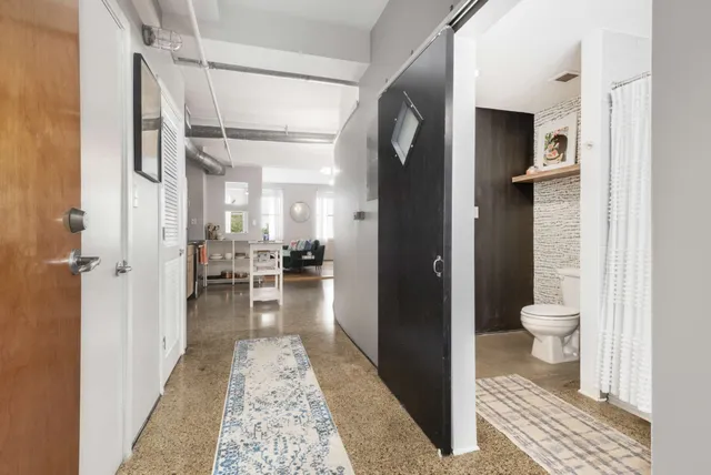 a bathroom with a glass shower door
