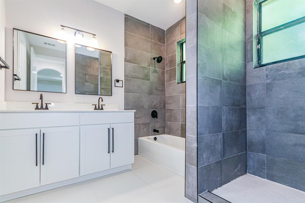 22808 Southwest 89th Path Cutler Bay, FL 33190 - Photo 19 of 35 a bathroom with a double vanity sink toilet and shower