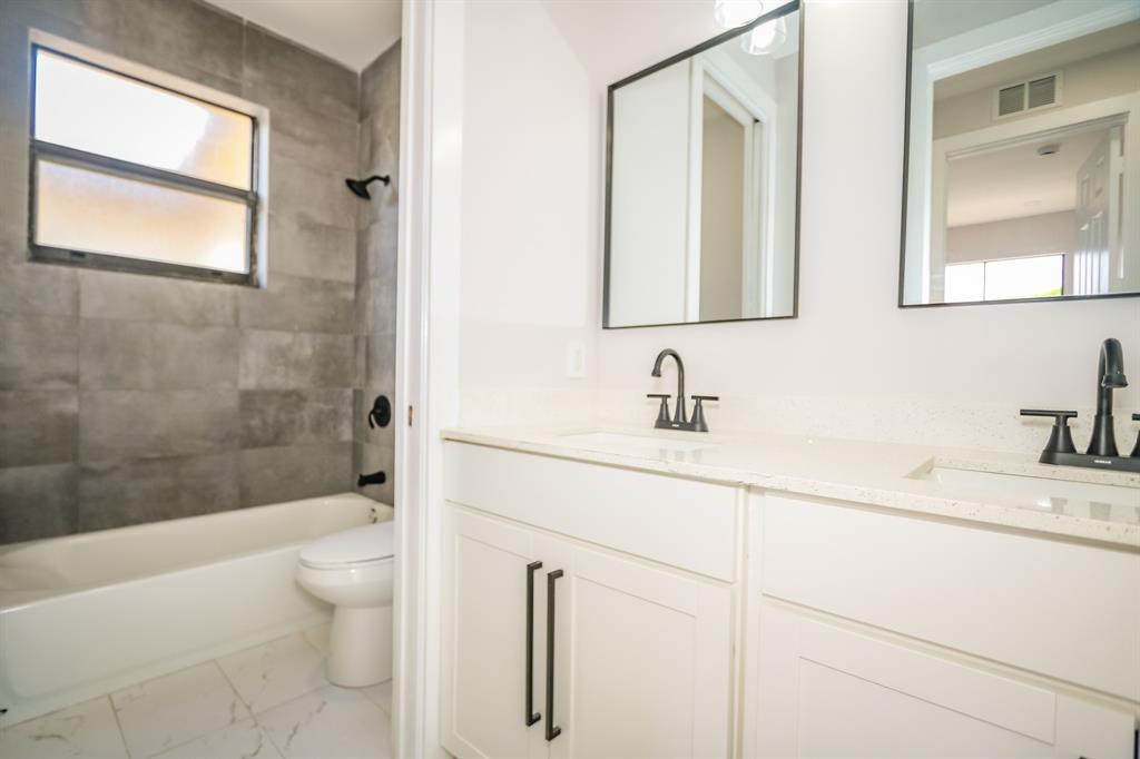 22808 Southwest 89th Path Cutler Bay, FL 33190 - Photo 22 of 35 a bathroom with a sink a toilet and shower