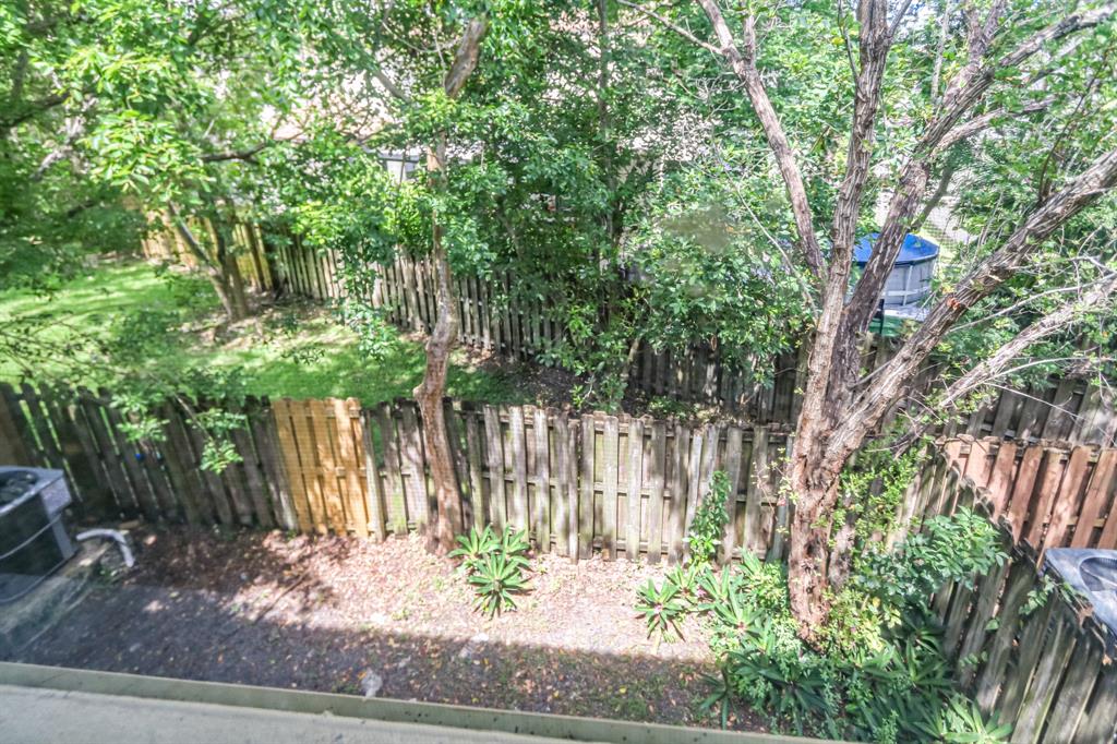 22808 Southwest 89th Path Cutler Bay, FL 33190 - Photo 29 of 35 a wooden fence with trees in the background