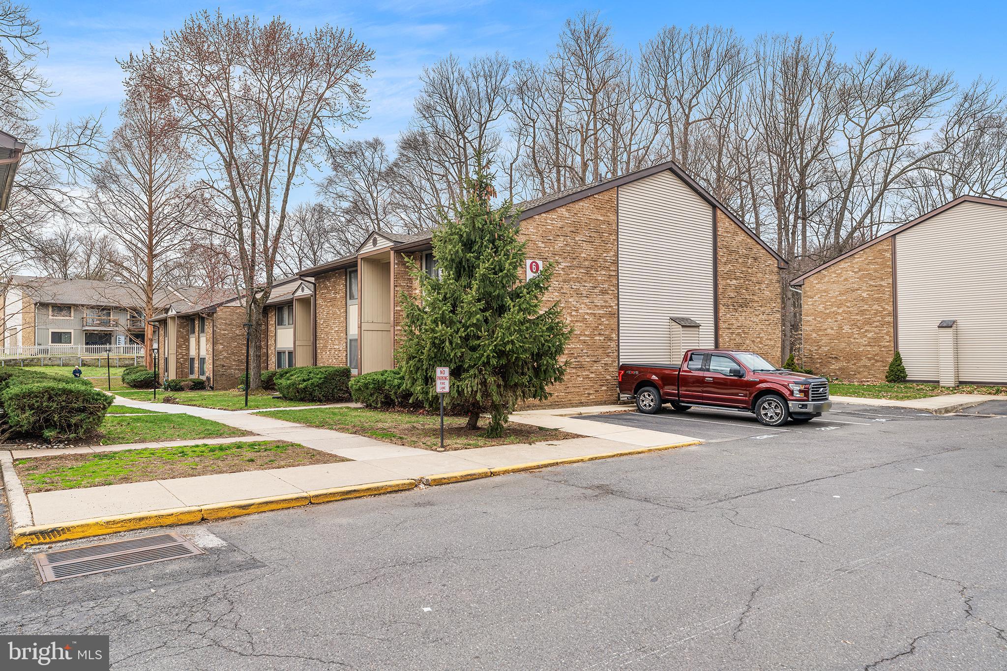 115 East Kings Highway, Unit 186 Maple Shade, NJ 08052 - Photo 25 of 25 a view of a parked cars in front of a building