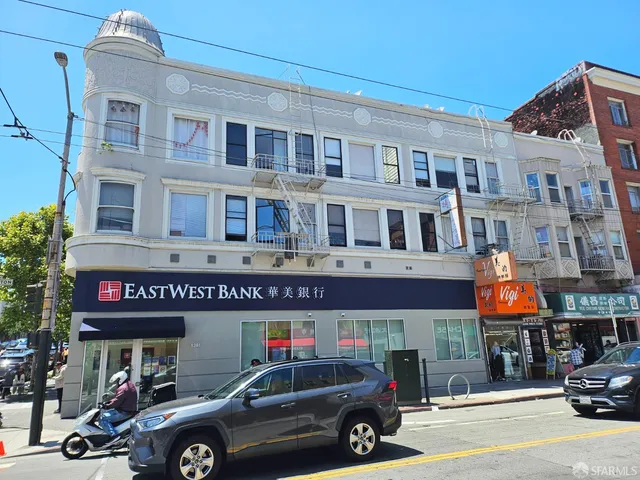 a front view of a building with parking