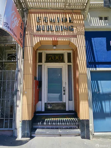 a front view of a house with a door and a window