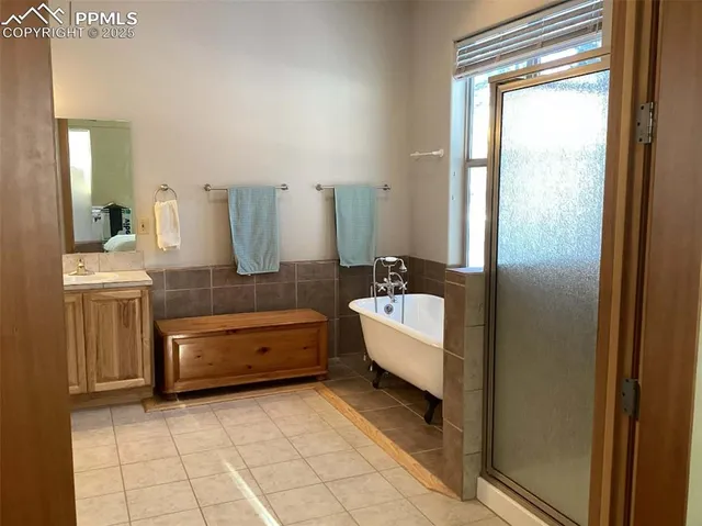 a bathroom with a bathtub and a sink