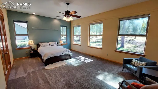 a bed room with a bed and a chandelier