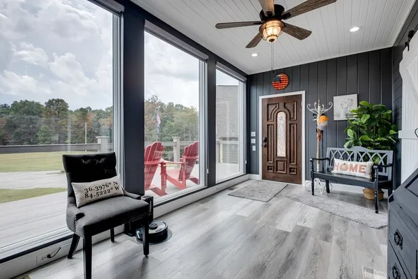 a dining table with chairs and kitchen view