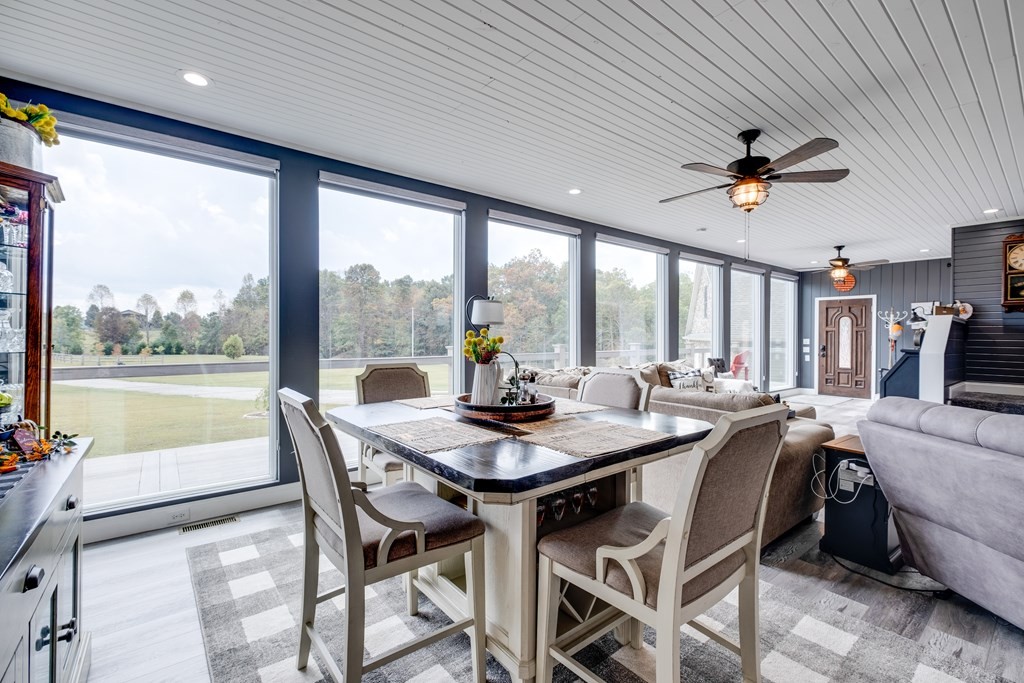 4700 Honey Creek Loop Road Allardt, TN 38504 - Photo 16 of 70 a view of a dining room with furniture window and outside view