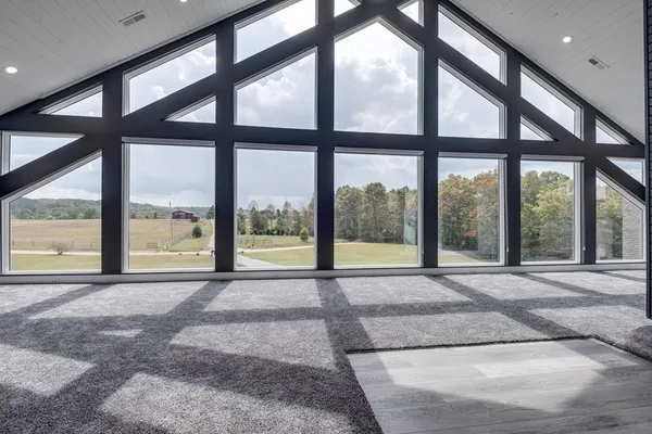 a view of an empty room with a large window
