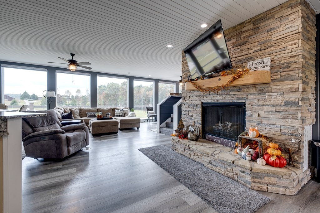 4700 Honey Creek Loop Road Allardt, TN 38504 - Photo 22 of 70 a living room with furniture and a fireplace
