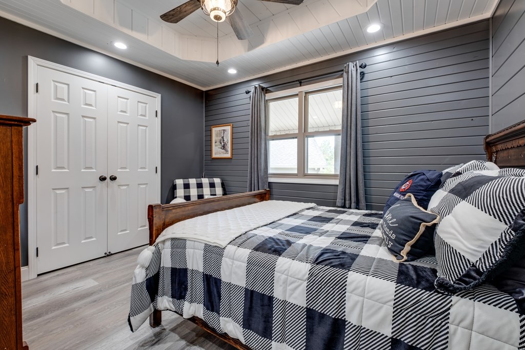 4700 Honey Creek Loop Road Allardt, TN 38504 - Photo 23 of 70 a bedroom with a bed and wooden floor