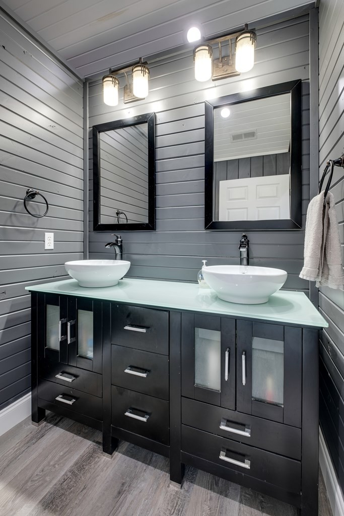 4700 Honey Creek Loop Road Allardt, TN 38504 - Photo 31 of 70 a bathroom with a sink and a mirror