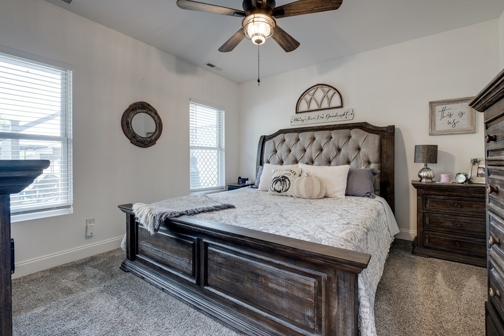 4700 Honey Creek Loop Road Allardt, TN 38504 - Photo 40 of 70 a bed sitting in a bedroom next to a window