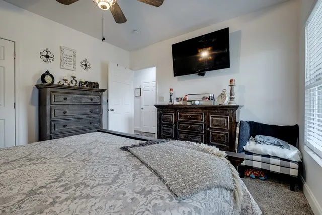 a bathroom with a sink mirror and vanity