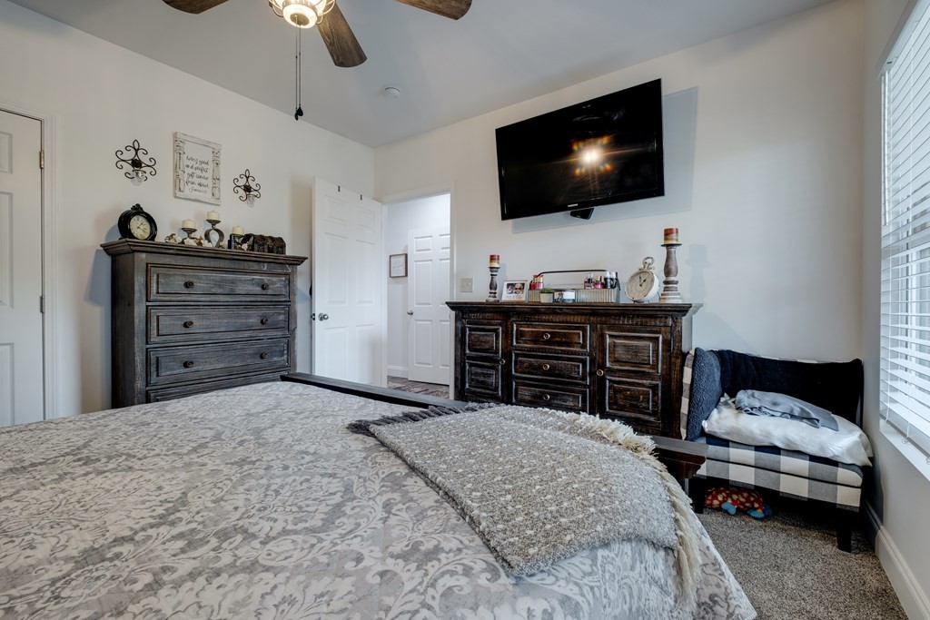 4700 Honey Creek Loop Road Allardt, TN 38504 - Photo 41 of 70 a bedroom with a bed and a flat screen tv