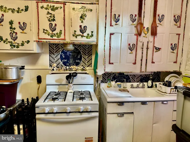 a kitchen with a stove and a refrigerator