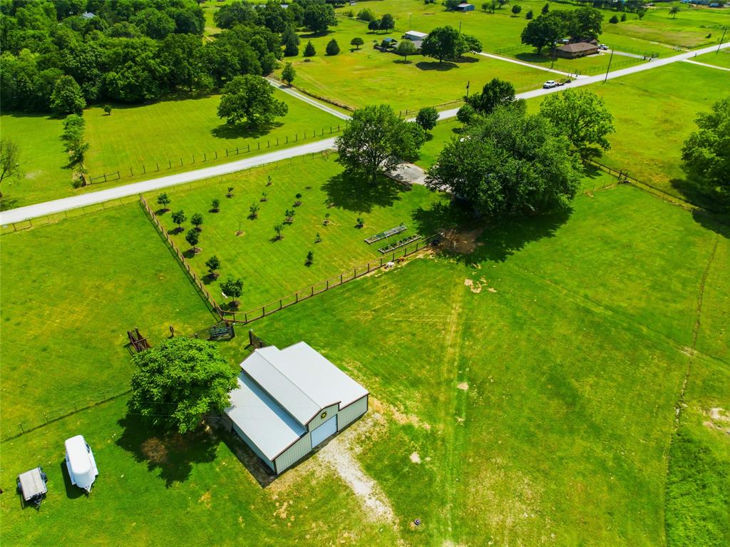 235 Magnus Road Denison, TX 75021 - Photo 13 of 35 a view of a yard with plants