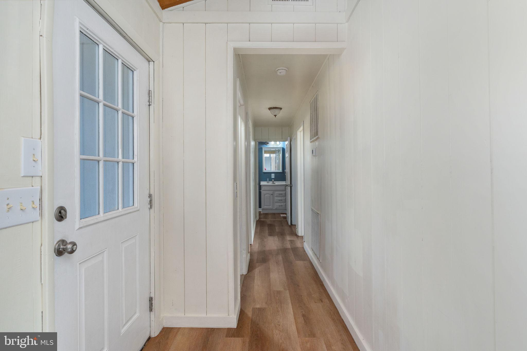 28 Tanglewood Road Palmyra, VA 22963 - Photo 14 of 44 a view of a hallway with wooden floor and staircase