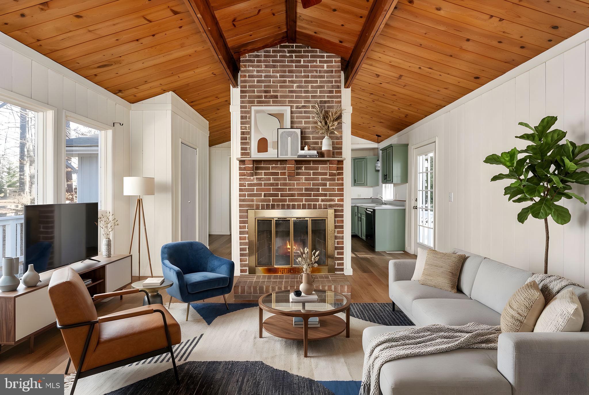 28 Tanglewood Road Palmyra, VA 22963 - Photo 6 of 44 a living room with furniture fireplace and a large window