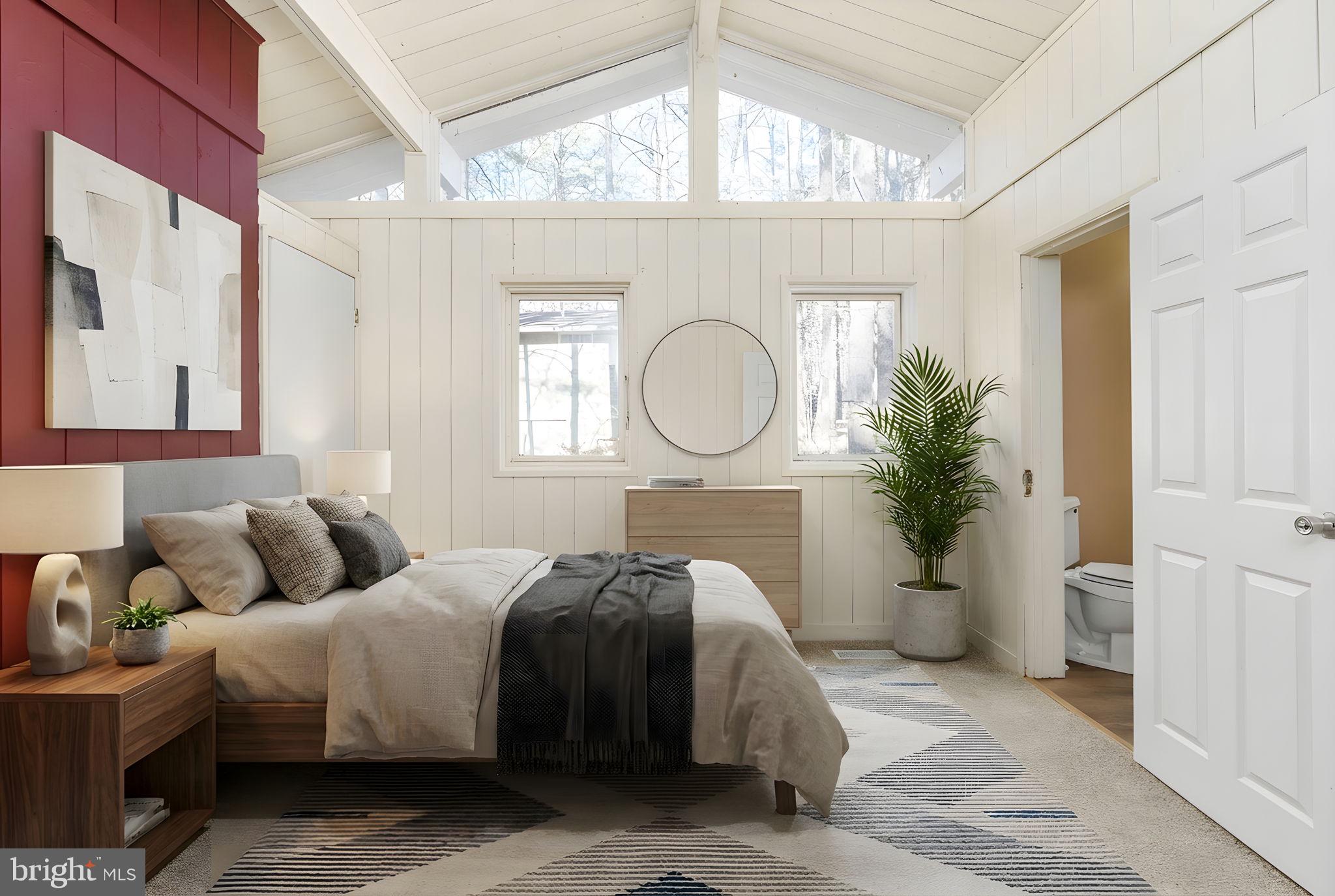 28 Tanglewood Road Palmyra, VA 22963 - Photo 10 of 44 a bedroom with a bed a mirror and a window