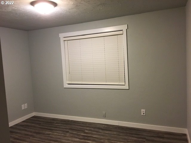 6803 C Street Springfield, OR 97478 - Photo 8 of 12 a view of a small space with wooden floor and a window