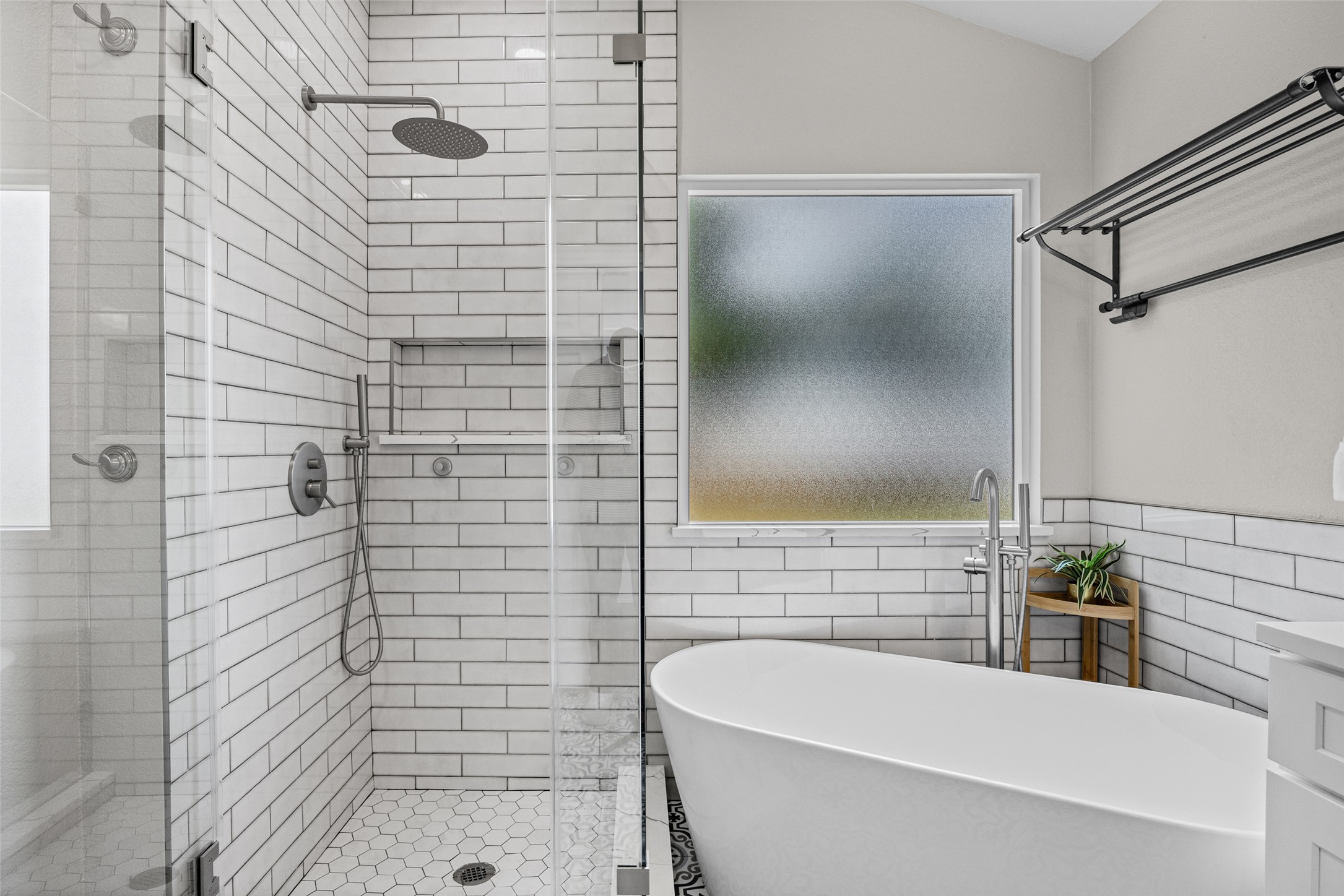 1524 Lochaline Loop Pflugerville, TX 78660 - Photo 14 of 22 Modern freestanding tub and sleek glass-enclosed shower create a tranquil bathing retreat.