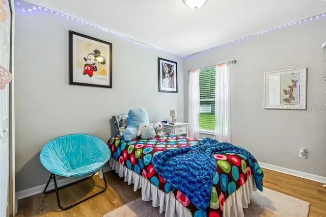 a bed room with furniture and a window