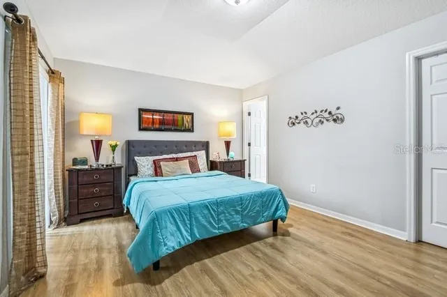 a bedroom with a bed and a table