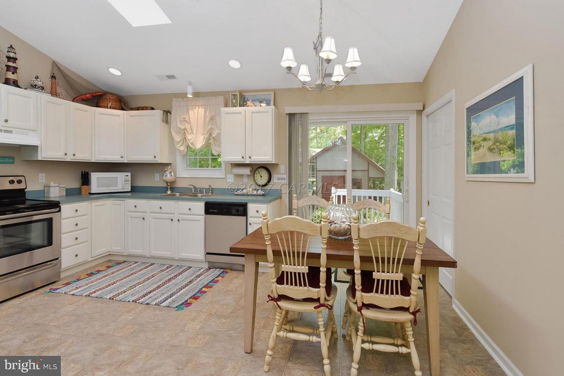 29 Watertown Road Ocean Pines, MD 21811 - Photo 15 of 49 a view of a dining room with furniture window and outside view