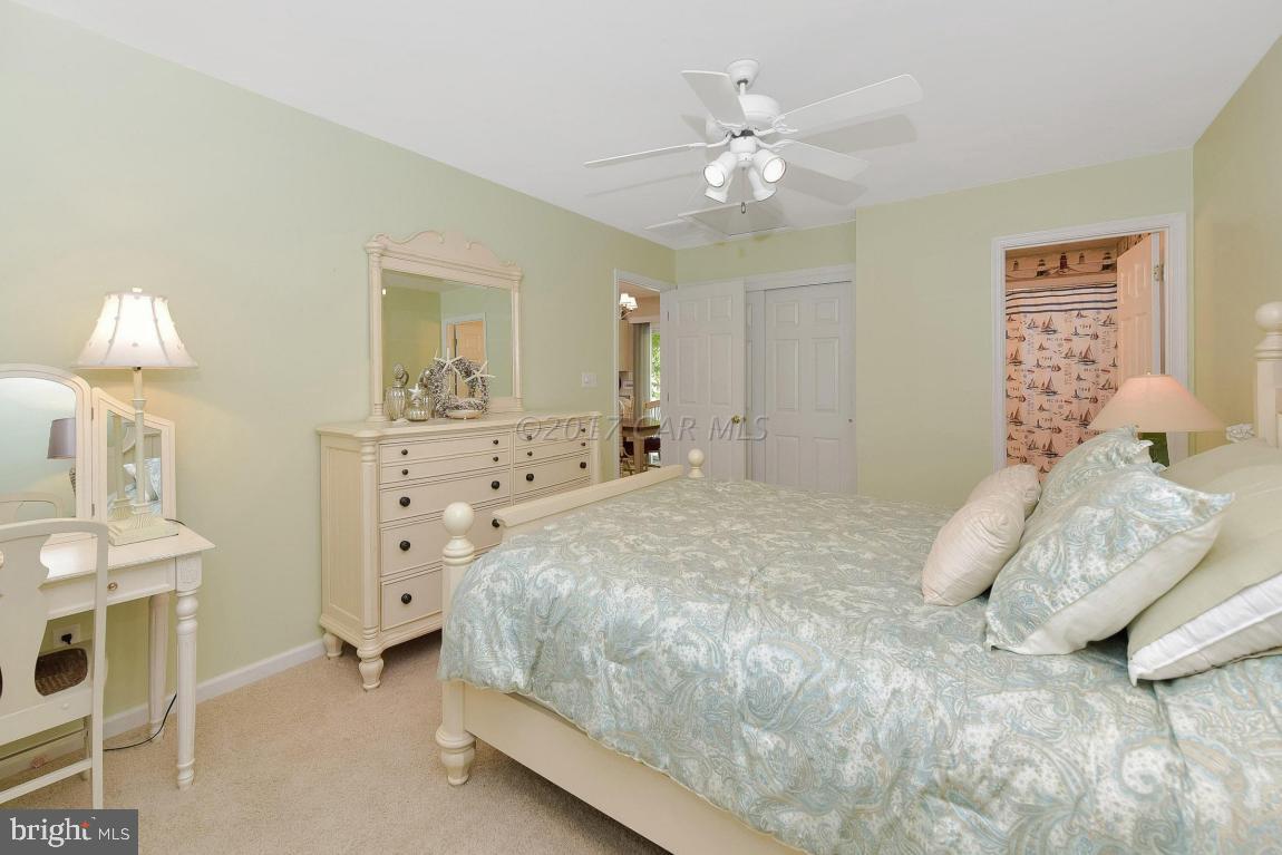 29 Watertown Road Ocean Pines, MD 21811 - Photo 20 of 49 a bedroom with a bed and a chandelier
