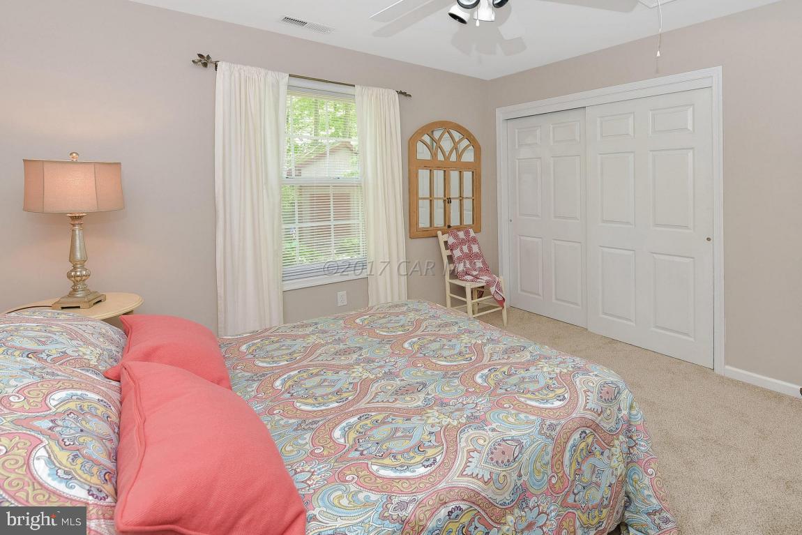29 Watertown Road Ocean Pines, MD 21811 - Photo 23 of 49 a bedroom with a bed and a window