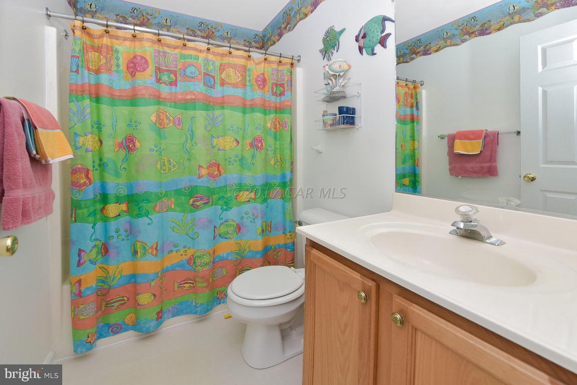 29 Watertown Road Ocean Pines, MD 21811 - Photo 26 of 49 a bathroom with a sink toilet and shower curtain