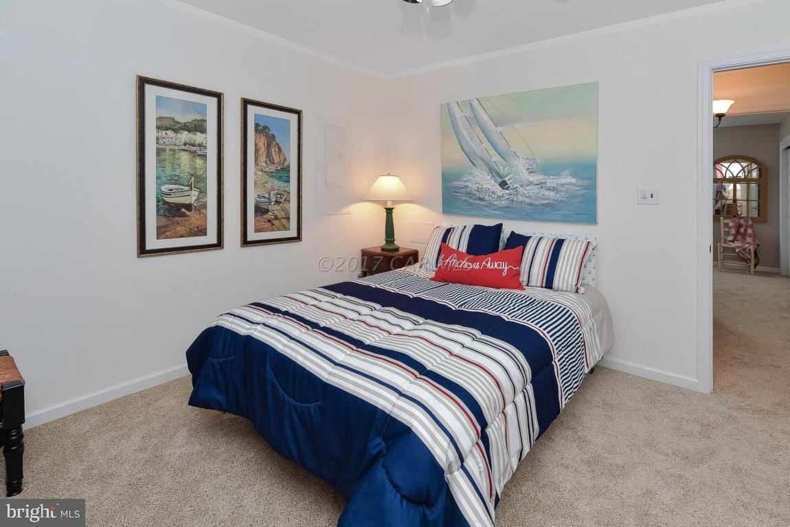 29 Watertown Road Ocean Pines, MD 21811 - Photo 28 of 49 a bedroom with a bed and painting on the wall