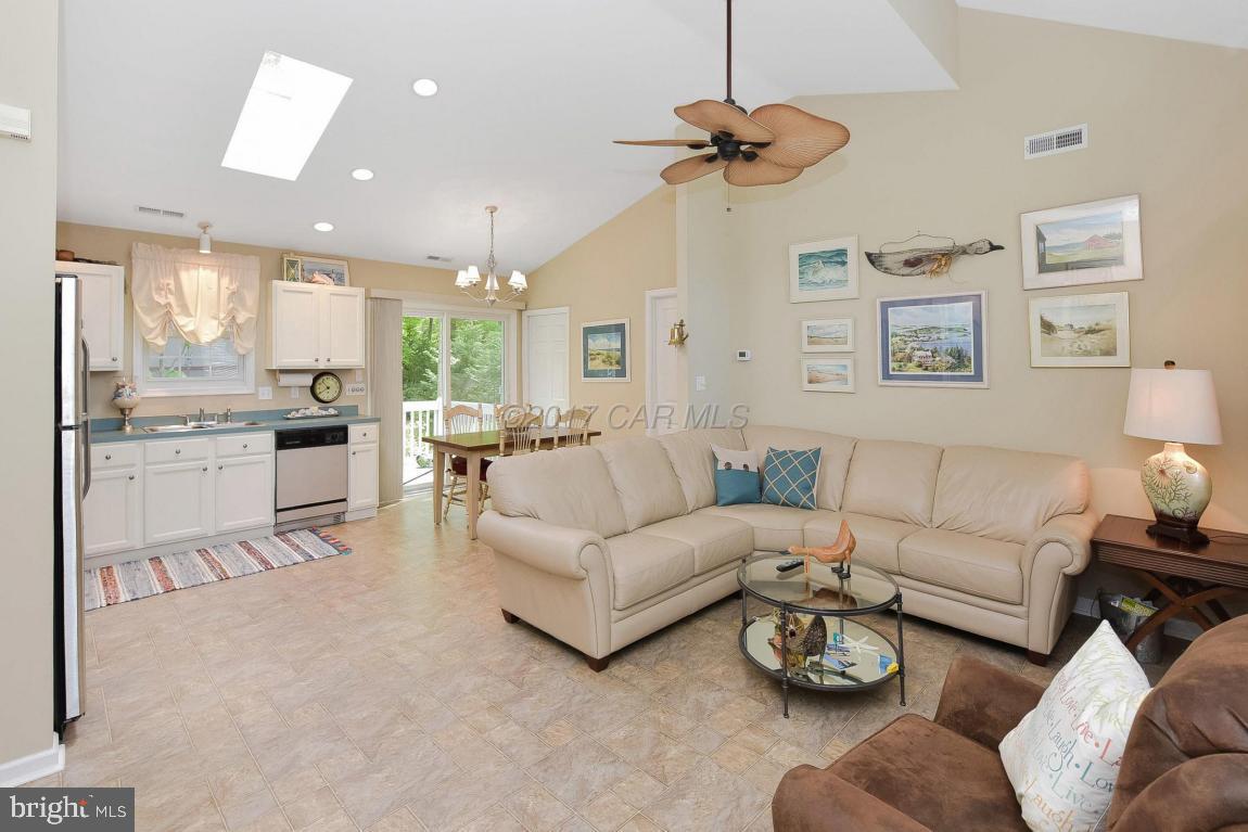 29 Watertown Road Ocean Pines, MD 21811 - Photo 4 of 49 a living room with furniture kitchen and a chandelier