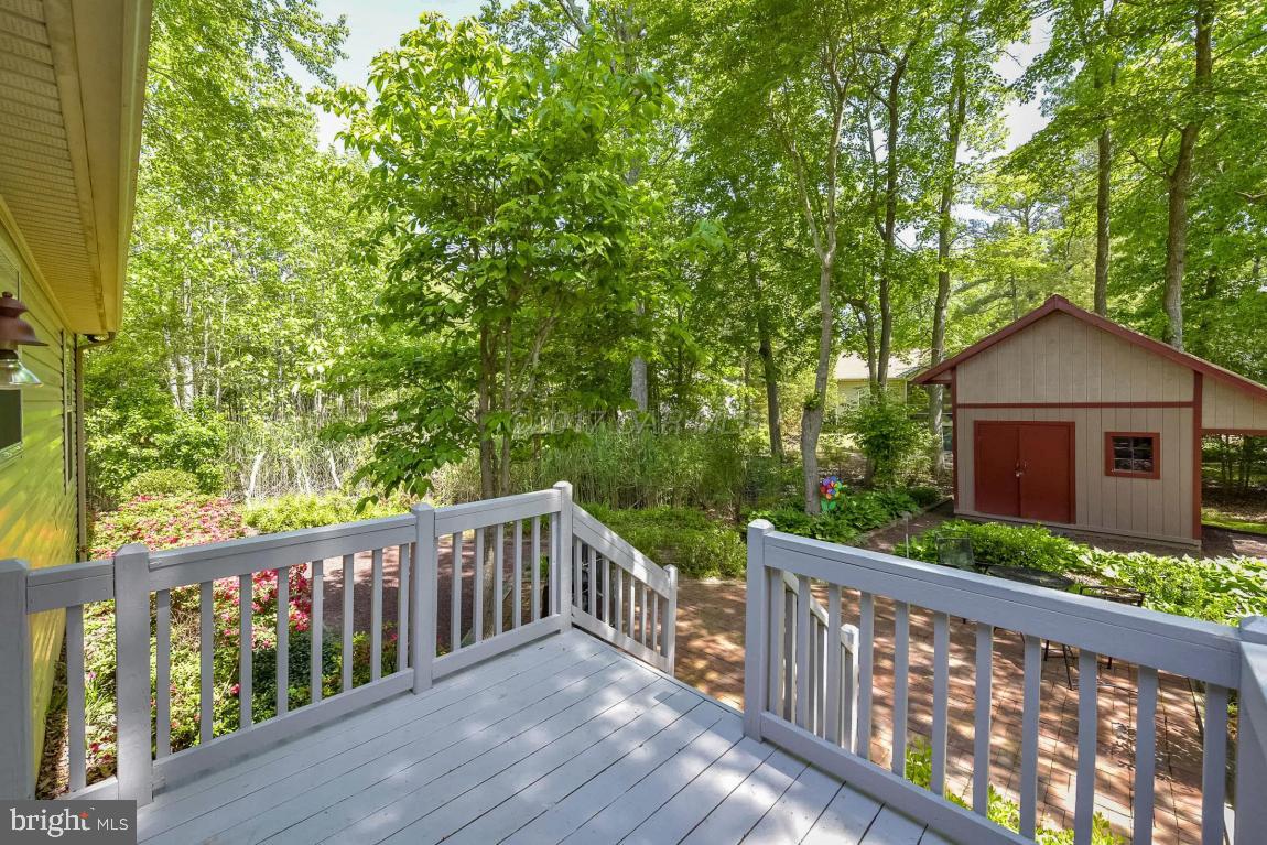 29 Watertown Road Ocean Pines, MD 21811 - Photo 33 of 49 a view of a wooden deck next to a yard