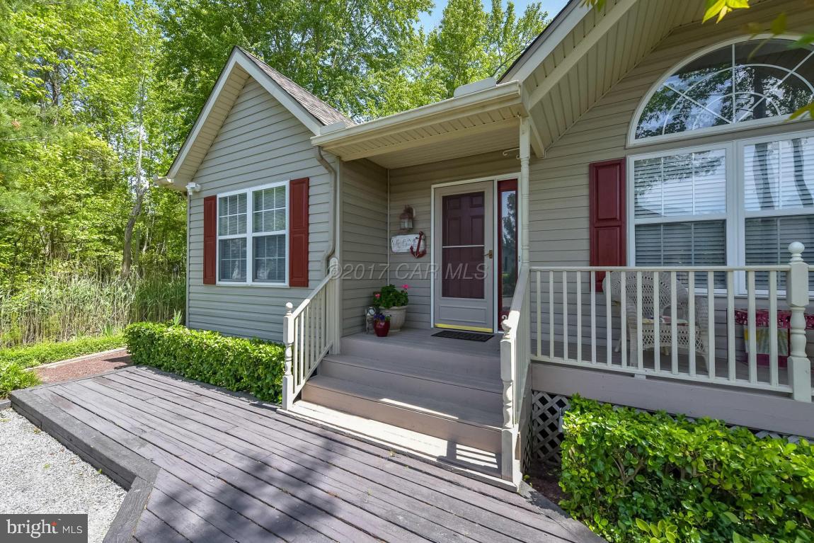 29 Watertown Road Ocean Pines, MD 21811 - Photo 40 of 49 a front view of a house with a yard