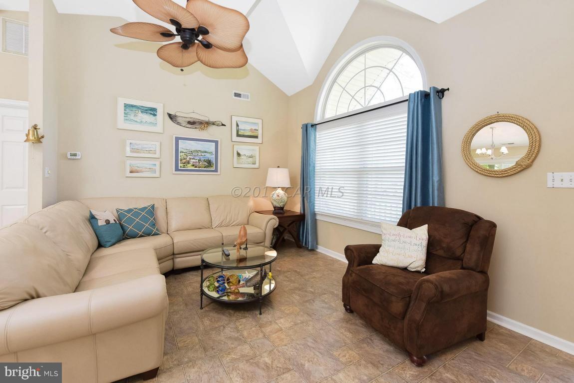29 Watertown Road Ocean Pines, MD 21811 - Photo 5 of 49 a living room with furniture a clock and a window