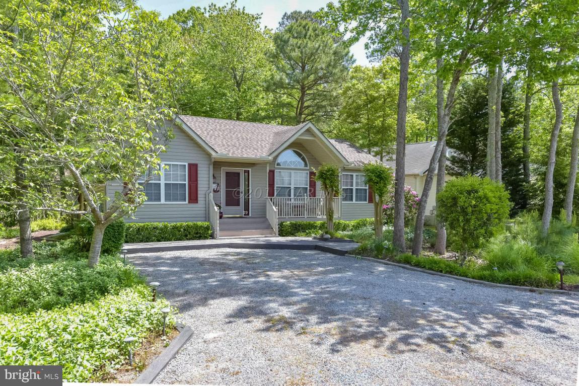 29 Watertown Road Ocean Pines, MD 21811 - Photo 45 of 49 a front view of a house with a garden