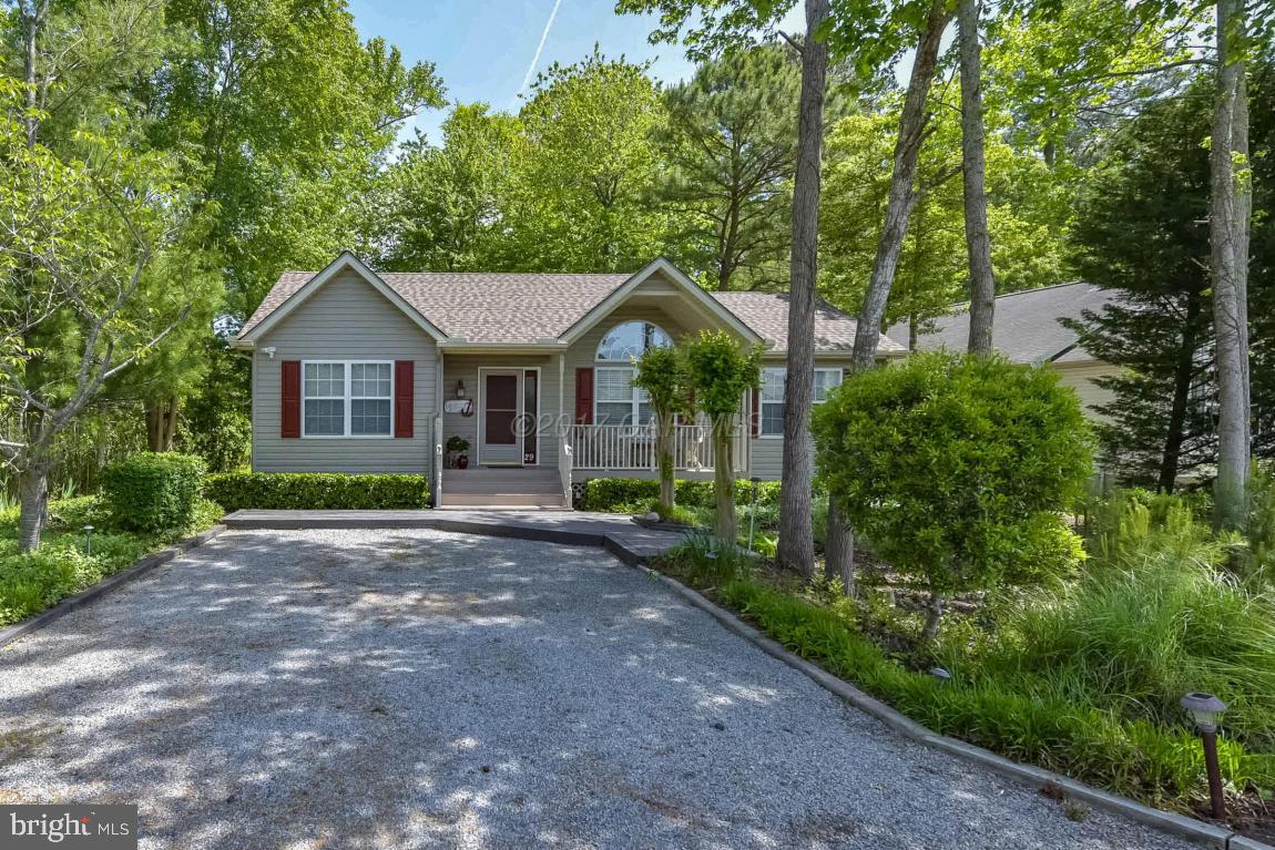 29 Watertown Road Ocean Pines, MD 21811 - Photo 46 of 49 a front view of a house with garden