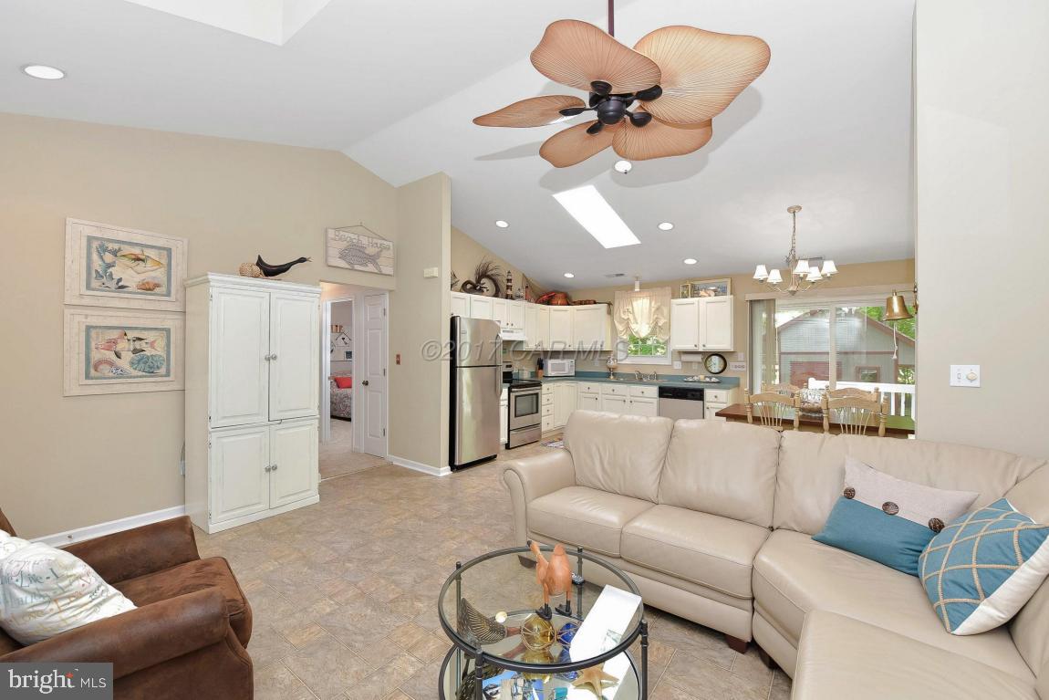 29 Watertown Road Ocean Pines, MD 21811 - Photo 6 of 49 a living room with furniture kitchen view and a chandelier