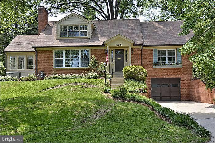 3216 Park View Road Chevy Chase, MD 20815 - Photo 1 of 29 a front view of a house with a yard and a garage