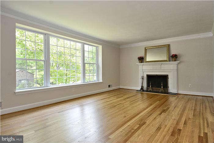 3216 Park View Road Chevy Chase, MD 20815 - Photo 13 of 29 a view of an empty room with wooden floor and a window