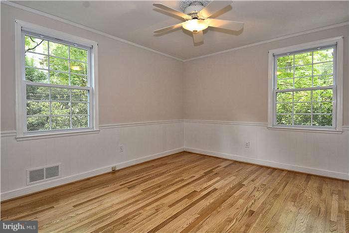 3216 Park View Road Chevy Chase, MD 20815 - Photo 14 of 29 wooden floor in an empty room with a window