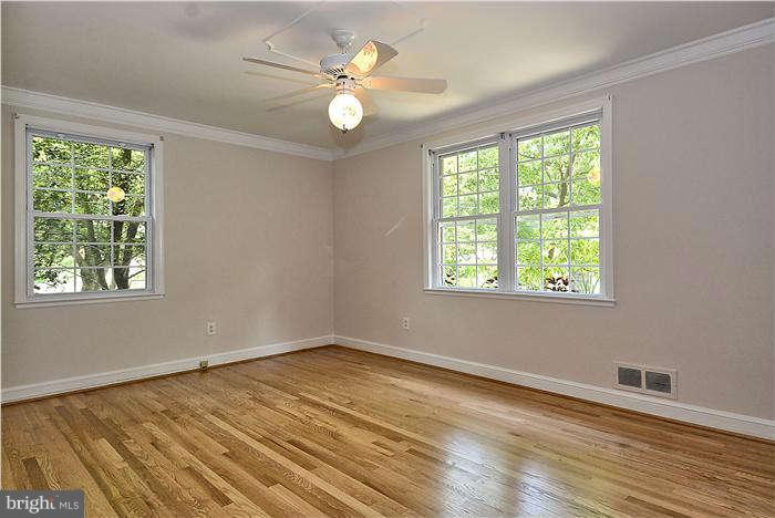 3216 Park View Road Chevy Chase, MD 20815 - Photo 15 of 29 a view of an empty room with wooden floor and a window