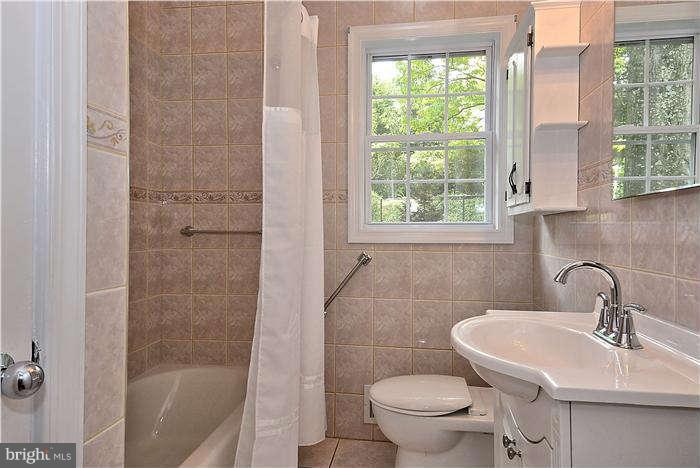 3216 Park View Road Chevy Chase, MD 20815 - Photo 17 of 29 a bathroom with a sink toilet and shower