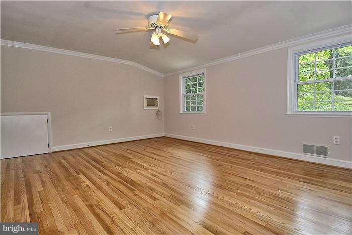 3216 Park View Road Chevy Chase, MD 20815 - Photo 18 of 29 a view of empty room with wooden floor and fan