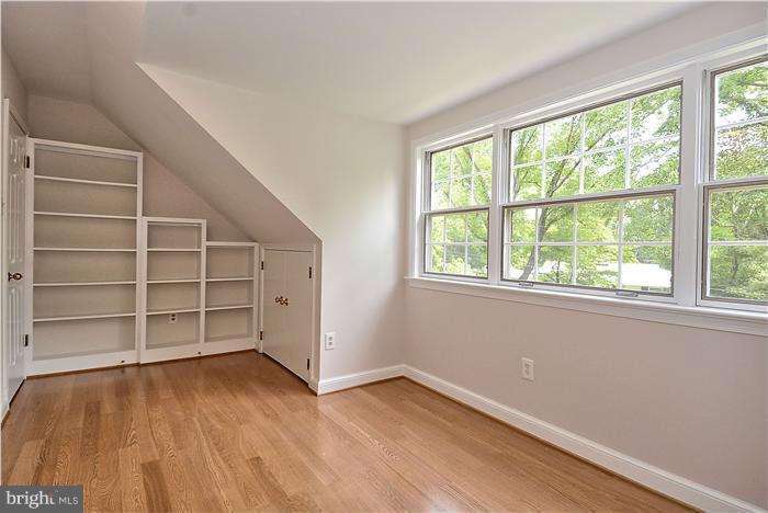 3216 Park View Road Chevy Chase, MD 20815 - Photo 19 of 29 wooden floor in an empty room with a window