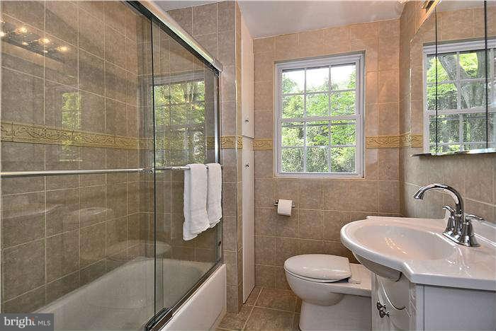 3216 Park View Road Chevy Chase, MD 20815 - Photo 22 of 29 a bathroom with a sink toilet and shower