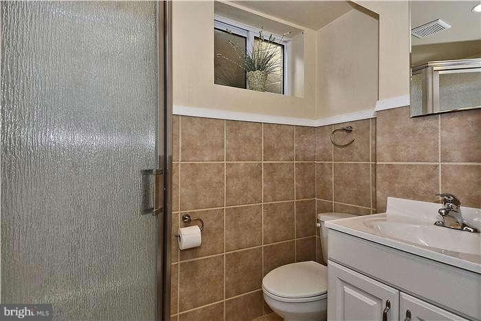 3216 Park View Road Chevy Chase, MD 20815 - Photo 29 of 29 a bathroom with a sink toilet and shower