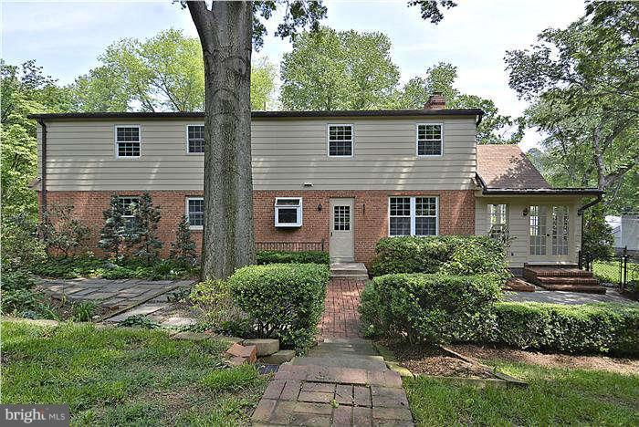 3216 Park View Road Chevy Chase, MD 20815 - Photo 4 of 29 a front view of a house with a yard